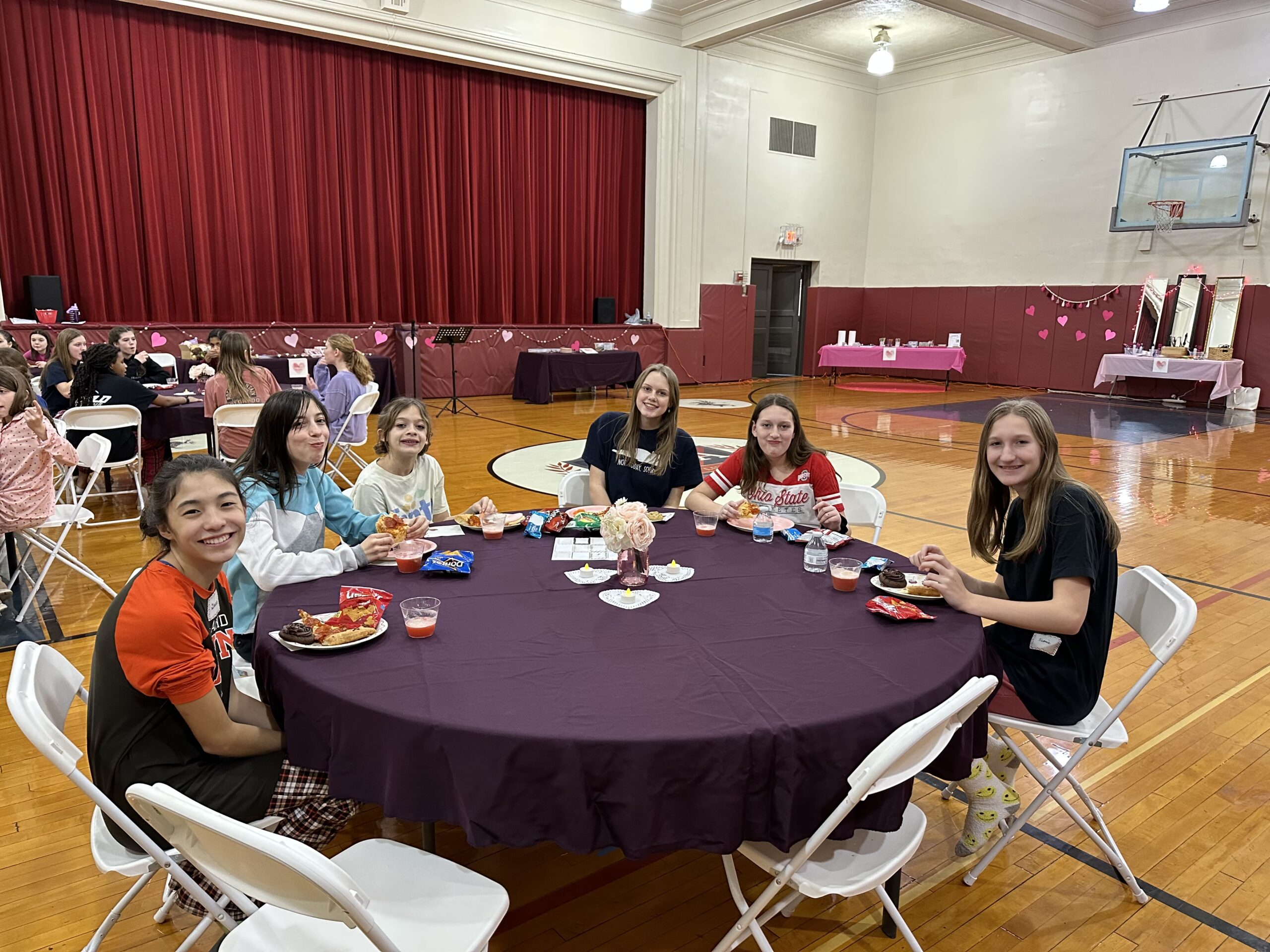 table of students and a leader eating