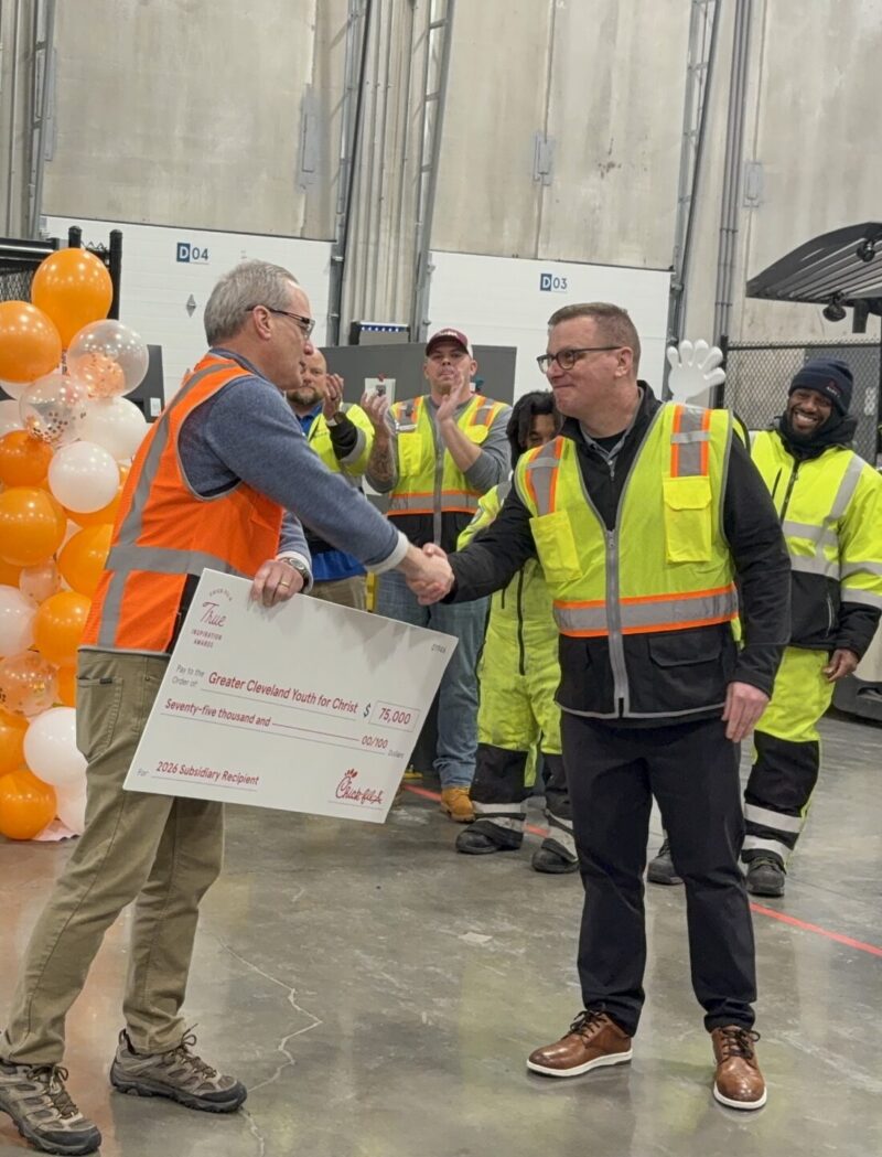 Brian Walls accepts check on behalf of YFC